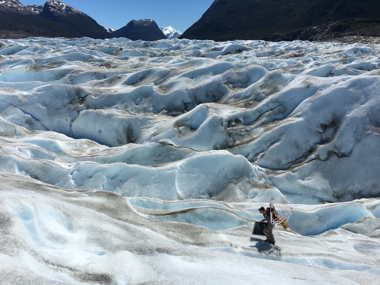 Installing GPS instruments on glacial ice in Patagonia