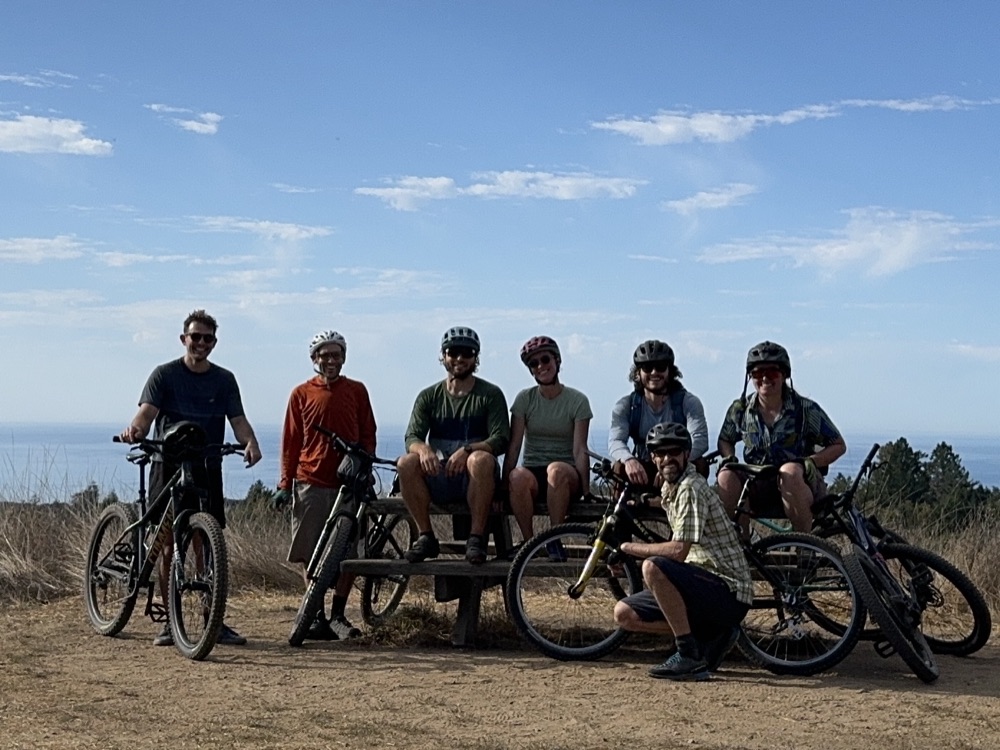 The research group on a mountain-bike ride above the coast
